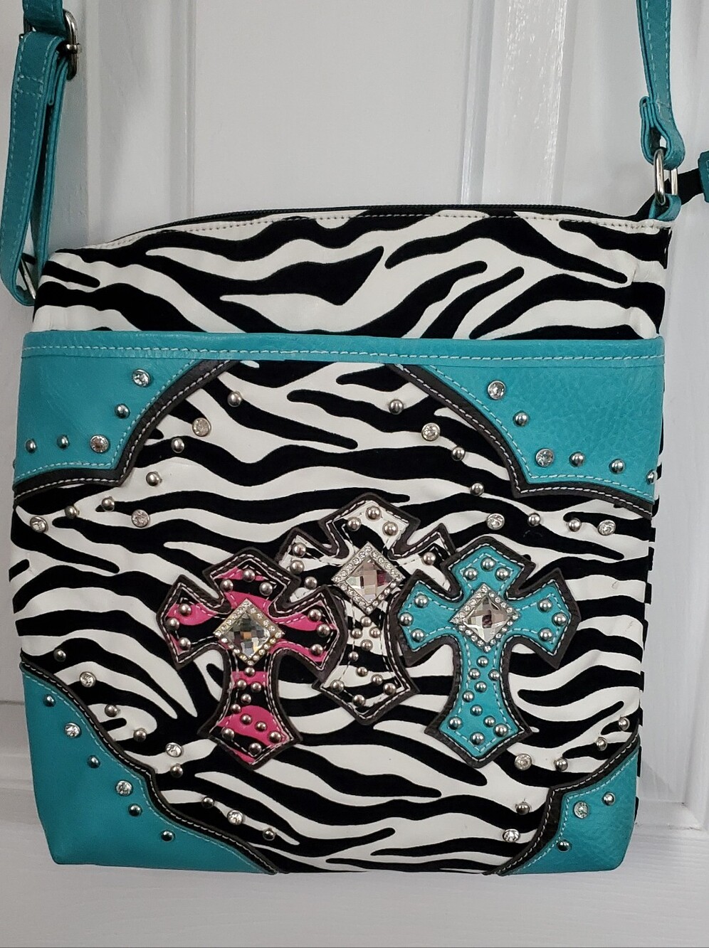Teal Zebra Print Crossbody Bag with Crosses And Silver, Metal Accents.
